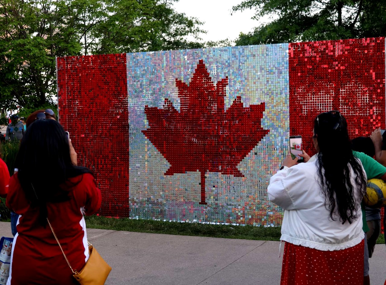 Canada flag custom shimmer wall with guests photographing it